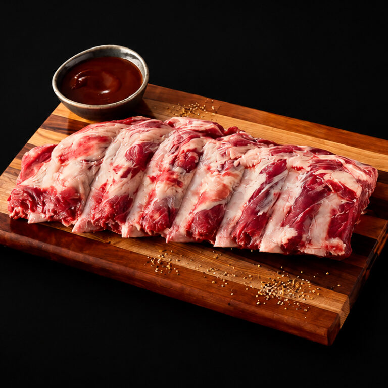 Raw Ribs on butcher block Cutting Board
