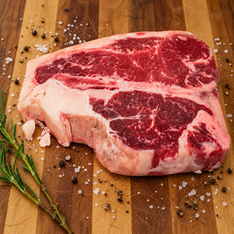 thick cut Marbled Porterhouse Steak with Rosemary and Seasoning